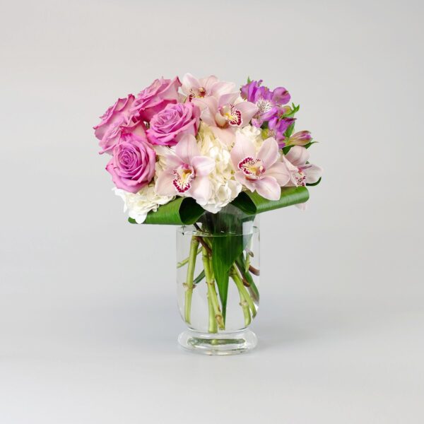 Photo of White Hydrangea, Mauve Roses, Pink Cymbidium Orchids, Purple and Alstroemeria in a vase